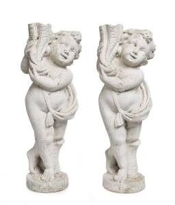 A pair of composite stone garden figures of cherubs, French 19th Century. 155cm high