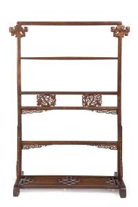 A Chinese carved timber clothes rack, late Qing to early Republic period. 177cm high, 123cm wide