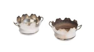 A pair of silver plated circular twin handled wine coolers, French, 19th century. 9cm high, 20cm wide across the handles