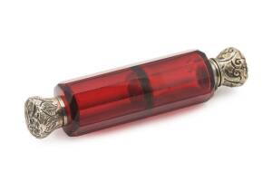 A double ended ruby glass scent bottle with silver caps, 19th century. 12cm