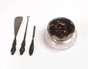 A sterling silver and tortoise shell topped crystal vanity jar, shoe horn, boot hook, and cuticle. 