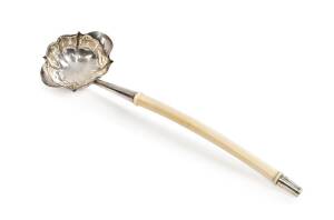 An antique silver ladle with ivory handle. 29cm