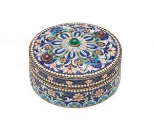 A Russian gem set silver and enamel circular box, set with cabochon garnets and an aventurine by the firm of Ovchinnikov, Moscow 1891, Imperial Warrant, Assay Master's mark of Lev Oleks. 7cm diameter, 105 grams