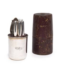 A gentleman's traveling silver set comprising a beaker, knife, fork and spoon plus condiment compartments, housed in original fitted leather case, 19th century, (missing a knife). 16.5cm