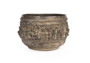 A Burmese silver bowl with fine repousse decoration. late 19th early 20th Century. 17cm high, 25cm diameter.