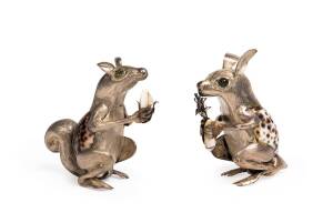 A pair of silver squirrel statues with shell decoration and peridot eyes, stamped "STERLING", 20th century. Tallest 11cm