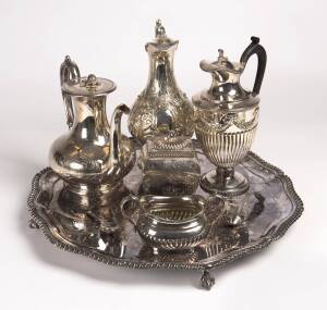 Silver plated serving tray, tea caddy and spoon, teapot, 2 wine jugs, sugar basin and sifting spoon. (8 items)