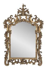 A Louis XV style foliate decorated composit over-mantel mirror. 164cm x 110cm 
