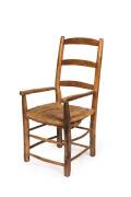 A rustic antique French provincial fruitwood armchair.