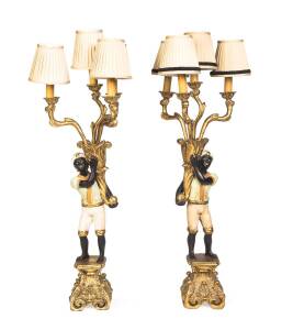 A pair of carved Blackamoor style four branch lamp. 91cm high