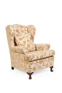 A floral upholstered Queen Anne style wingback armchair