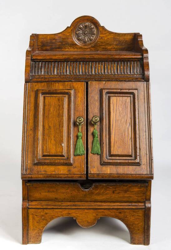 A Victorian carved oak fuel cabinet. 69cm high, 39cm wide, 41cm deep 