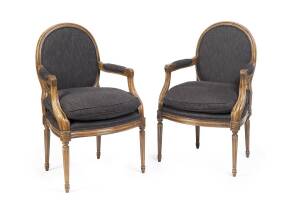 A pair of Louis XVI style carved beech fauteuil, 20th century 