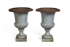 A pair of cast iron garden urns with painted finish. 43cm high. 
