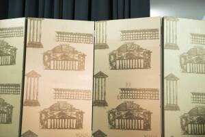 A four panel screen covered in gold Florence Broadhurst wallpaper. 242cm high. 