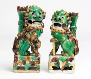 A pair of "Sancai" glazed lions, Qing dynasty (1644-1911), 2.1cm high; together with a South East Asian pottery jar. 23 x 18cm