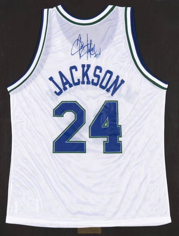JIM JACKSON, signature on Dallas Mavericks basketball singlet, framed & glazed, overall 71x92cm. With CoA.