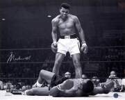 MUHAMMAD ALI, signed b/w photographs of Ali standing over Sonny Liston, size 51x41cm. Wholesale quantity (3). With 'Online Authentics' Nos.OA-8090314-316.