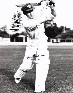 DON BRADMAN, signed photograph of the Don playing a straight drive, window mounted, framed & glazed, overall 31x38cm. With CoA.