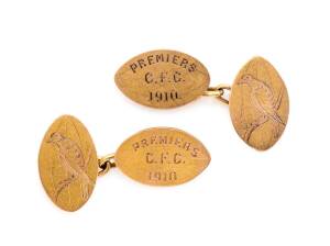 COLLINGWOOD - DICK LEE'S PREMIERSHIP CUFF-LINKS: Pair of 15ct gold cuff-links, each comprising a pair of footballs linked by a gold chain, one football engraved "PREMIERS/ C.F.C./ 1910", the other football engraved with a magpie, and on reverse initials "