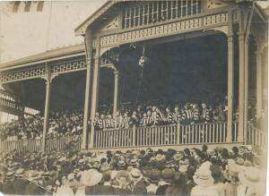 COLLINGWOOD: Superb original photograph capturing the unfurling of the 1910 Premiership flag, prior to the first match of 1911, size 15x11cm.