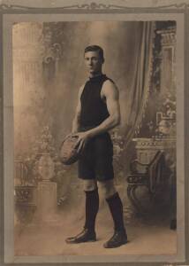 Unidentified portrait of a footballer wearing a dark jumper, believed to be Collingwood's Tom Wraith (60 games, 1916-20), size 17x23cm.