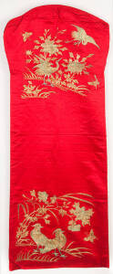 A pair of red silk Nonya wear seat covers, early 20th century