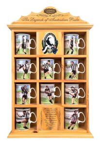 COLLINGWOOD: "The Legends of Australian Rules - Collingwood Football Club", set of 10 fine bone china mugs in custom display cabinet, overall 42x63cm. Featuring Albert Collier, Gordon Coventry, Ron Todd, Des Fothergill, Lou Richards, Bobby Rose, Des Tudde