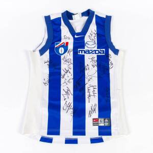 NORTH MELBOURNE: c1990s jumper with 19 signatures including Wayne Carey, Glen Archer, Brent Harvey & David King.