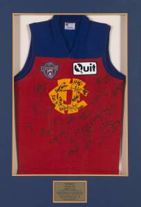 FITZROY: 1996 Fitzroy football jumper with AFL Centenary & sponsors badges, signed by the whole squad of their final year, 33 signatures including Brad Boyd, Chris Johnson, Matthew Primus & Martin Pike, framed & glazed, overall 67x113cm. With CoA.