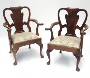 A pair of walnut armchairs, part 18th century