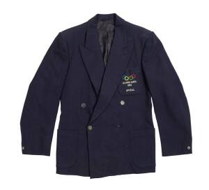 1956 MELBOURNE OLYMPICS: Official's Blazer, navy blue wool with embroidered Olympic Rings & "OLYMPIC GAMES 1956/ OFFICIAL" on pocket. Good condition.