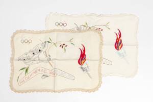 DOILYS: Two ornamental mats embroidered with koalas, Olympic rings, torch & "XVI Olympiad 1956, Melbourne", each 45x30cm.