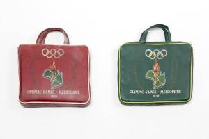 CUSHIONS, with carry handles, both showing Olympic rings, torch and text "Olympic Games, Melbourne, 1956", one with background colour green, other maroon.