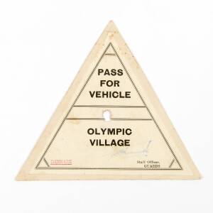 "Pass For Vehicle/Olympic Village", triangular sign, with "Denmark" typed in red at lower right.