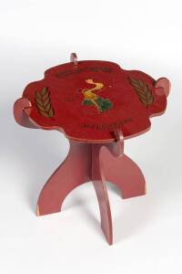 1956 OLYMPICS COFFEE TABLE, in scarce red colour, that breaks down into 3 pieces, the top with "XVIth Olympiad, 22 November - 8 December, 1956 (Olympic rings torch & map of Australia), Melbourne, Australia".