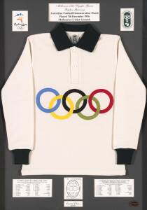 Sydney 2000/AFL display comprising Replica Guernsey (white with Olympic Rings in colour on front) as used in the Australian Football Demonstration Match played at the MCG during the 1956 Melbourne Olympics, limited edition 28/2000, attractively mounted, f