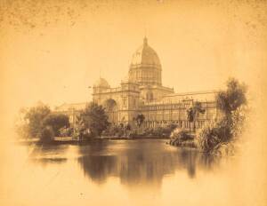 JOHN PAINE (1834-1915): "Exhibition Building, Melbourne, Australia, 1887", c1887 sepia albumen photograph (20x15cm), mounted on card with hand-written notes in margin, some foxing, window mounted, overall 50x40cm.