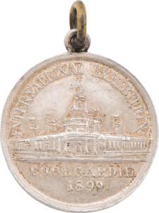 MEDALLIONS: Silver (19mm) with chain ring, 'INTERNATIONAL EXHIBITION COOLGARDIE / 1899' Unc, plus PPC showing photo of 'SCHOOL OF MINES Coolgardie.