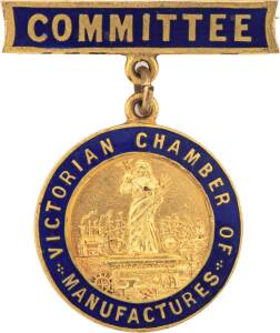 Victorian Chamber of Manufactures committee badges 'EXHIBITION COMMITTEE 1913' in blue enamel and sterling silver and 'COMMITTEE' in blue enamel and gold gilt. (2 Items)