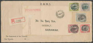 1922 Department of Treasury OHMS cover (280x127mm) to "Goebilt/Sarawak" with Bicolours &frac12;d to 3d and red & black/white Port Moresby registration label, Sydney & Singapore transits and 'KUCHING' arrival b/s, vertical fold at left. Rare destination. [Address