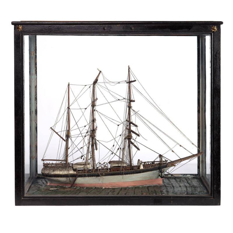 A model ship in ebonized timber and glass case