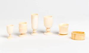 Five whale tooth and bone cups and a napkin ring ♦