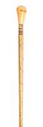 A whalebone walking stick with whale's tooth and pearl shell handle ♦