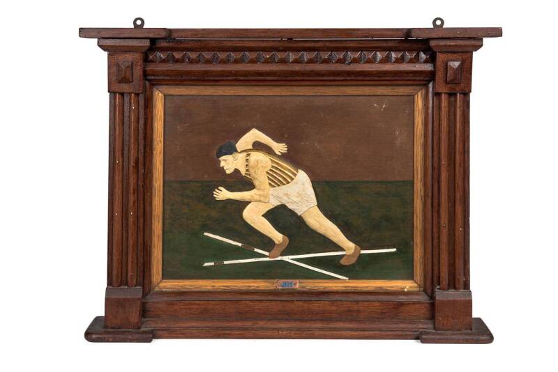 A carved folk art panel of an athlete titled "JIM"