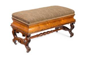 An upholstered rosewood and cedar long stool