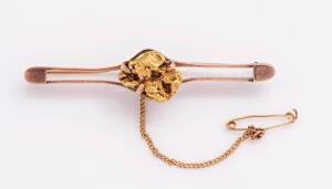 A gold nugget bar brooch. 15ct yellow gold. Weight 9.48 grams. Length 60mm.