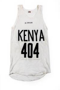 BEN JIPCHO'S KENYA RUNNING SINGLET, with "KENYA" & number "404"on front, endorsed "B.Jipcho". [Ben Jipcho won a silver medal in the 3000m steeplechase at the 1972 Munich Olympics. At the 1974 Commonwealth Games he won gold medals in the 5000m & 3000m stee