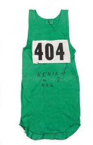 BEN JIPCHO'S RUNNING SINGLET, with number "404" pinned on, endorsed "Kenya No 404, B.Jipcho". [Ben Jipcho won a silver medal in the 3000m steeplechase at the 1972 Munich Olympics. At the 1974 Commonwealth Games he won gold medals in the 5000m & 3000m stee