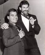Large photograph of Greg Williams & Robert Dipierdomenico with their 1986 Brownlow Medals (50x61cm); also framed poster "Inside Football, Player of the Year, Greg Williams, Carlton", window mounted, framed & glazed, overall 60x75cm. - 2